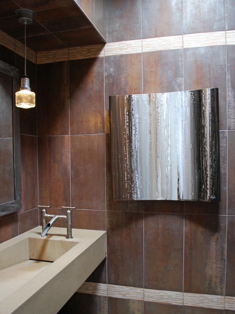 Brown Bathroom With Floating Trough Sink and Industrial Light Fixture