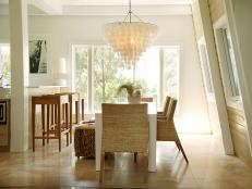 Coastal Dining Room With Shell Chandelier and Seagrass Chairs