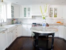 Designer Marianne Brown designs a bright and simple kitchen to accommodate large family gatherings with a round island for food prep and plenty of niches for added storage.