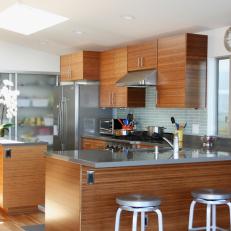 Brown and Gray Contemporary Kitchen With Stainless Countertops
