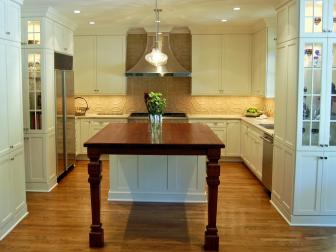 White Transitional Kitchen With Wood Island & Neutral Tile Backsplash 