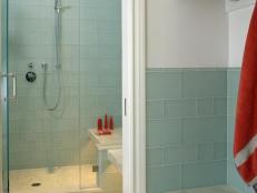 Blue Tiled Glass Shower With Red Accents 