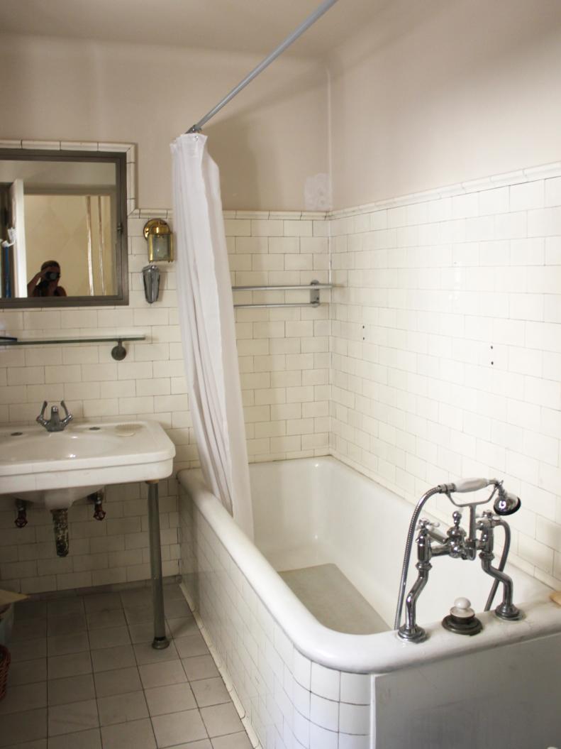 Dingy Bathroom With White Subway Tile, Porcelain Tub