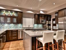 Contemporary Kitchen With Dark-Stained Cabinets and Waterfall Island 