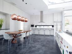 Designer Laura Umansky transforms a kitchen by updating the existing cabinetry and floor for a fresh, airy design.
