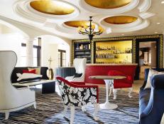 Designer Troy Beasley creates a sophisticated living space, complete with two distinct seating areas and a stunning bar, perfect for entertaining.