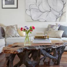 Natural Wood Coffee Table and Charcoal Artwork with Muted Palette