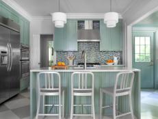 Designer Mark Williams explains how he created a colorful family-friendly kitchen for a couple with widely differing styles.