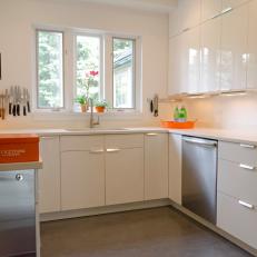 White Modern Kitchen With Orange Accessories