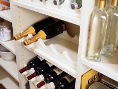 Shelves in pantry for bottle storage
