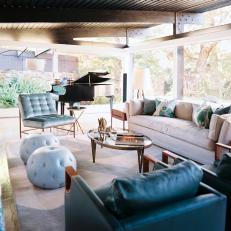 Eclectic Outdoor Living Room With Blue and Neutral Furnishings 