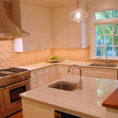 Neutral Kitchen With Textured Tile Backsplash 