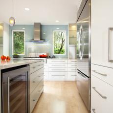 Contemporary White Kitchen With Stainless Steel Accents