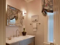 Neutral Powder Room With Marble Countertops and Red Ceiling 