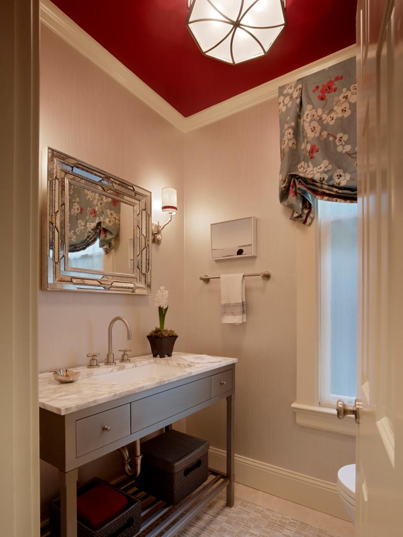Neutral Powder Room With Marble Countertops and Red Ceiling 