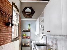 Designer Tyler Karu adds vintage furnishings and a sustainable spin to the remodel of an authentic open loft in Portland, Maine.