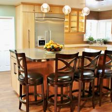 Barstools Surround L-Shaped Island in Contemporary Kitchen