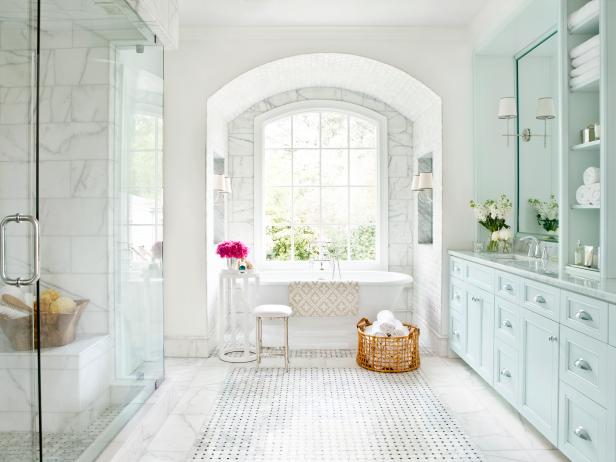 White Bathroom With Arched Window, Glass Shower and Freestanding Tub