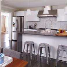 Eat-In Gray Kitchen With Metal Barstools