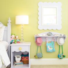Yellow Girls' Room With White Nightstand and Shelf