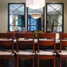 Traditional Dining Room With Mirrored Focal Wall