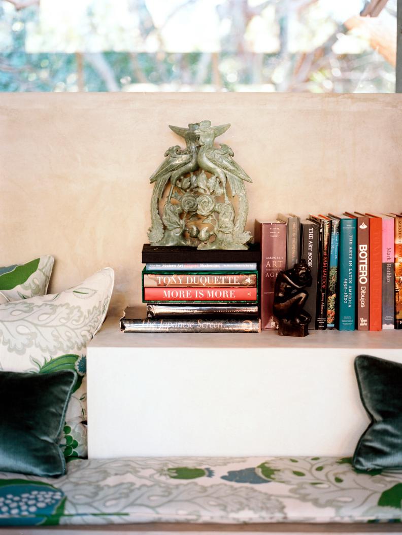 Low Shelf With Styled Books, Small Hard-Carved Figurines