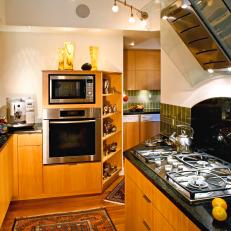 Brown and White Kitchen With Glass Range Hood