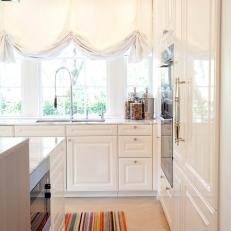 White Kitchen With Colorful Rug 