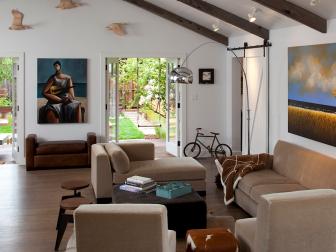 Large Modern Great Room With Taupe Furniture and Funky Artwork