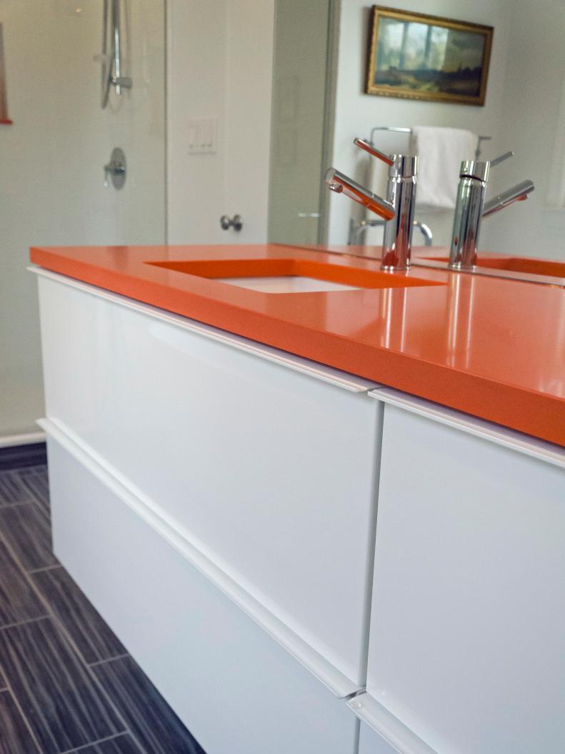 Orange Bathroom Countertop And White Drawers