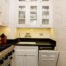 Small White Kitchen With Subway Tile and Glass Cabinets