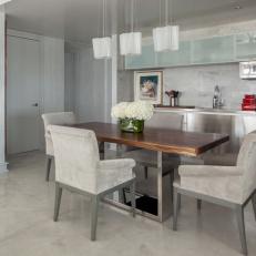 Gray Open Plan Kitchen With Wood Dining Table