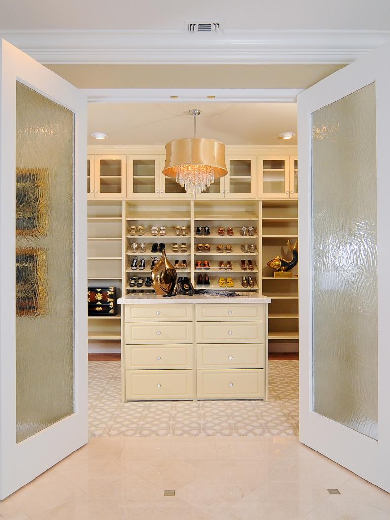 Luxurious Master Closet with Frosted Glass Doors 