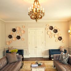 Floral Wall Art and Leather Sofas in Eclectic Sitting Room