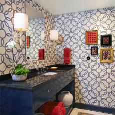 Eclectic Bathroom With Blue Vanity and Patterned Wallpaper