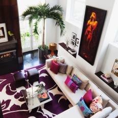Modern Living Space Grounded by Bold Purple Floral Print Rug