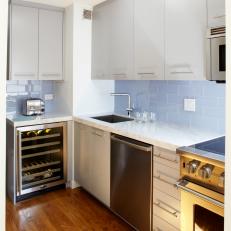 White Kitchen With Blue-Gray Glass Subway Tile