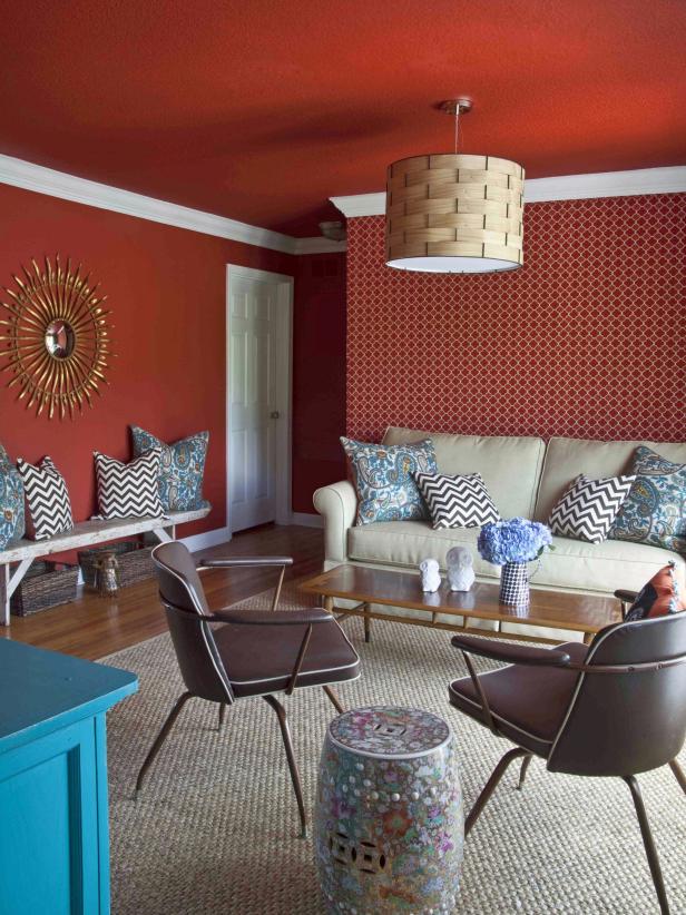 Living Room With Red Walls and Ceiling and Patterned Wallpaper 