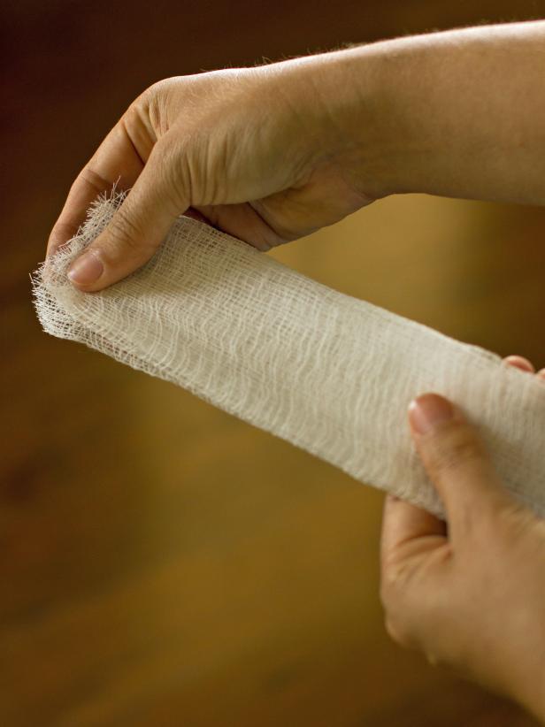 Cut a 5-foot length of cheese cloth and fold it over two times.