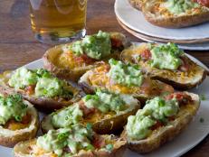 Plate of Potato Skins Topped With Guacamole