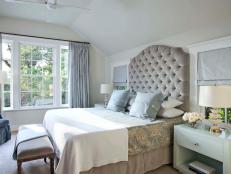 Traditional Bedroom With a Gray Tufted Headboard