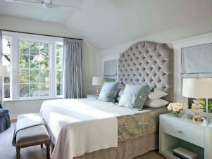 Traditional Bedroom With a Grey Tufted Headboard