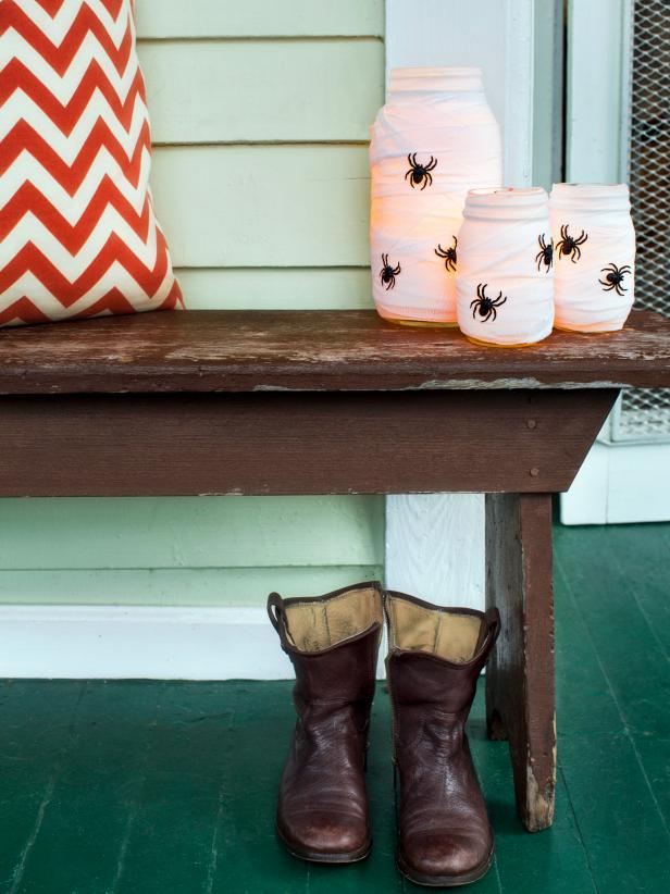 Mason Jars With Plastic Spiders on Halloween Porch