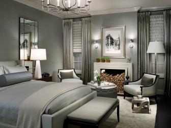 Contemporary Gray Bedroom With Fireplace And Chandelier