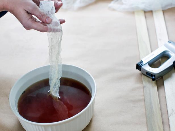 Soak cheesecloth in a bucket of strong tea overnight so that its white tone takes on an aged affect.