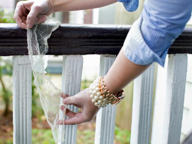 Remove cheesecloth from bucket, then drape over a bannister, fence or door to properly dry.