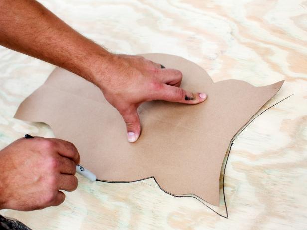 Place the cut-out directly onto the surface of the plywood, then trace with pen or marker.