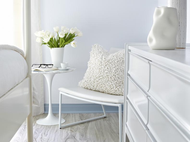 All White Room Corner Seating Area With Modern Decor. 