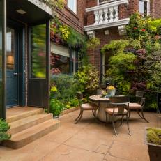Courtyard With Lush Landscaping and Bistro Dining Set