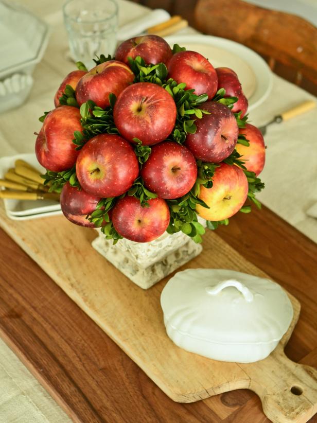 Put fall's bounty on display by making a topiary out of fresh pears or apples as a centerpiece for your Thanksgiving table or buffet. Tip: Refrigerate topiary or store in a cool place to extend its life. Use foam fruit and preserved or artificial greenery to make a centerpiece that will keep indefinitely.